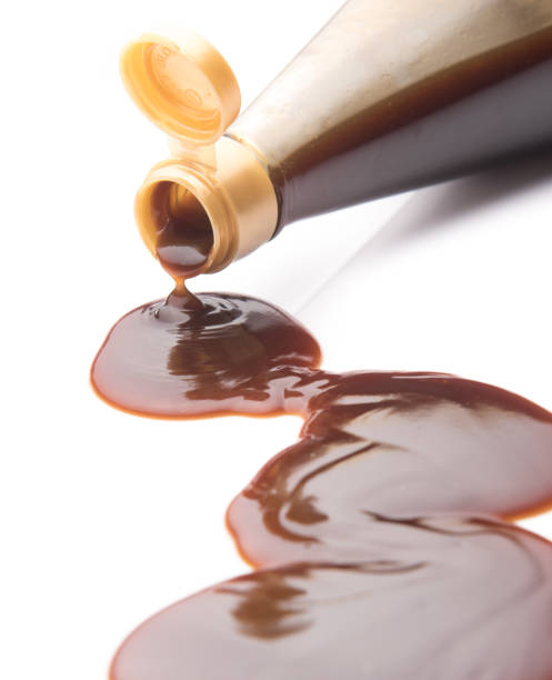 istock Oyster sauce poured from a bottle on a white background 841300700