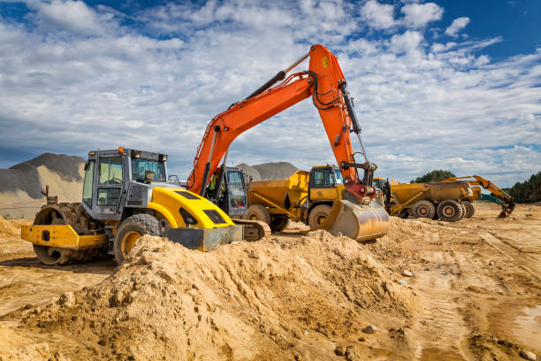 Road construction machinery on the construction of highway Road construction machinery on the construction of highway S6, Goleniów, Poland building sand stock pictures, royalty-free photos & images