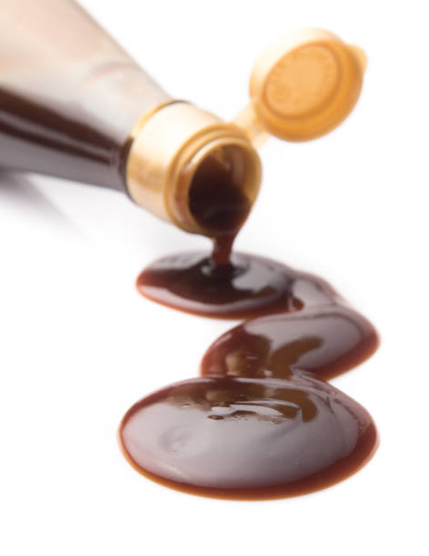 istock Oyster sauce poured from a bottle on a white background 841301640