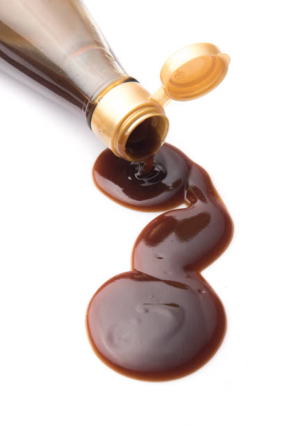 istock Oyster sauce poured from a bottle on a white background 841303944