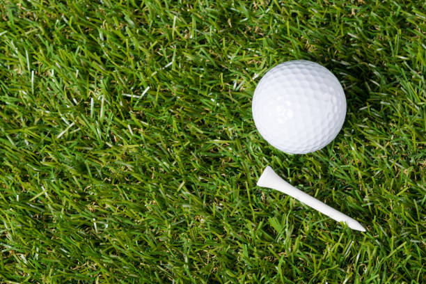 istock Ball and tee for golf lie on green grass 841303972