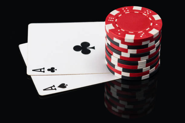 istock Two aces on poker cards and chip count on them 841304074