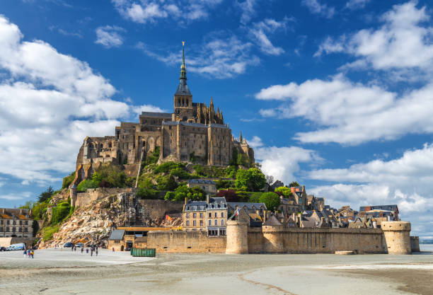 istock Saint Michael's Mount is an island commune in Normandy. The island has held strategic fortifications since ancient times and has been the seat of a monastery. 841307906
