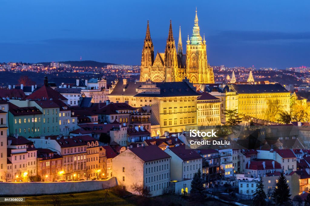 Prague Castle complex with gothic St Vitus Cathedral, Hradcany, Prague, Czech Republic. UNESCO World Heritage. Panoramic aerial shot from Petrin Hill. Above Stock Photo
