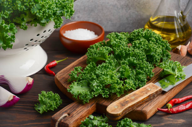 istock Fresh green kale with olive oil and spices, ready for cooking 841308078