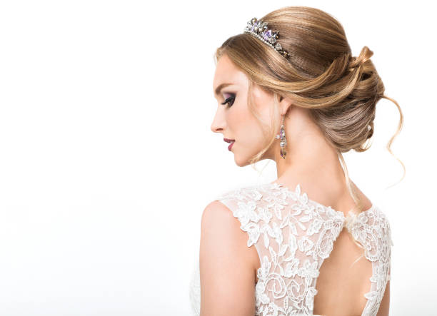 Young pretty caucasian bride in wedding dress Young pretty caucasian bride in wedding dress at studio bridal hair stock pictures, royalty-free photos & images