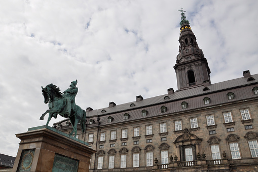 Denmark, Copenhagen - July 16, 2013: Parliament building and the statue of King Frederick Seventh