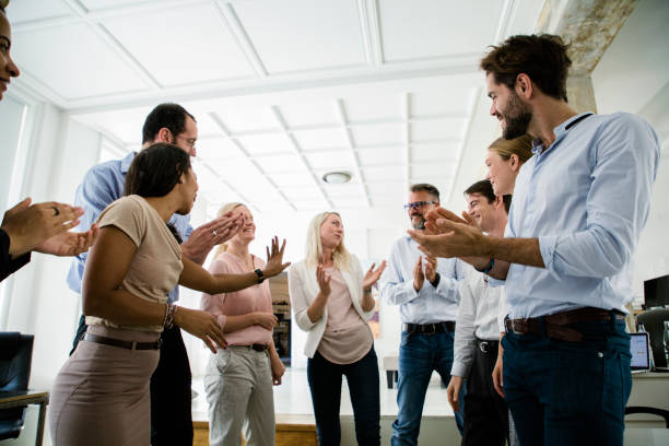 istock Office Team Psyching Each Other Up During Morning Meeting 841337376