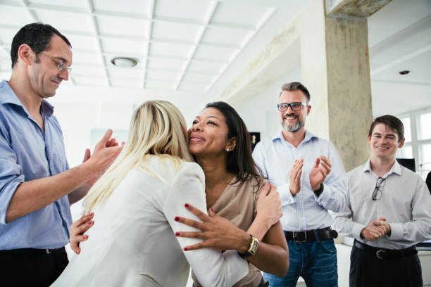 istock Business Colleagues Embrace Each Other Celebrating Successful Pitch 841337524