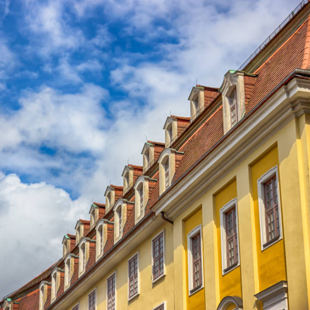 istock Yellow house and cloudy sky. Details. Dresden, Germany 841351058