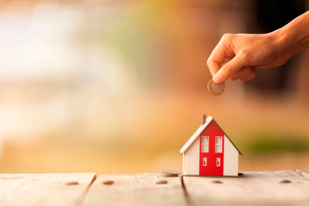 Real Estate Agent with house model and saving concepts