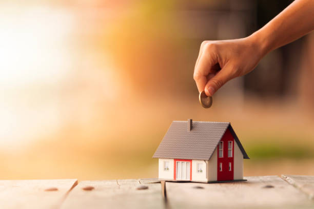 istock Real Estate Agent with house model and saving concepts 841354028