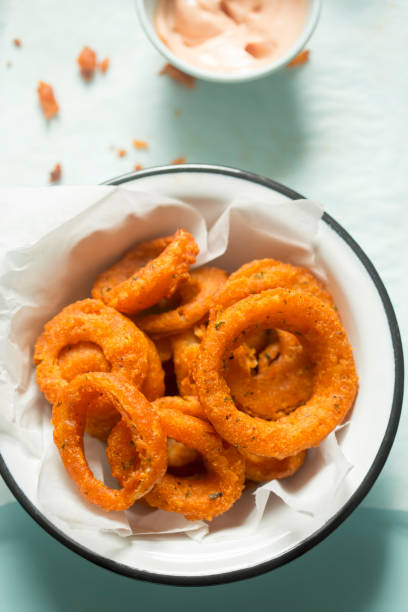 Onion spicy rings with mayo ketchup dip Onion spicy rings with mayo ketchup dip fried onion rings stock pictures, royalty-free photos & images