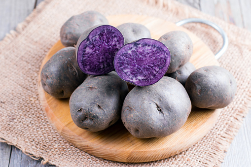 Purple sweet potato on a wooden table