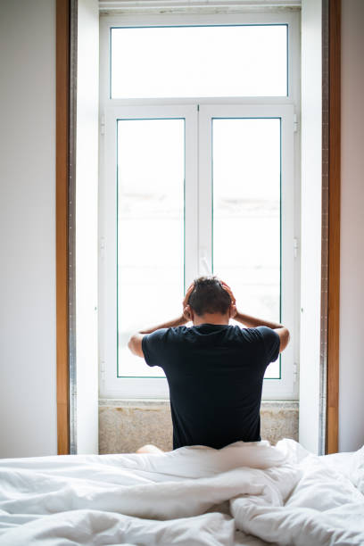 istock Man feeling back ache in the bed after sleeping in the morning 841364634