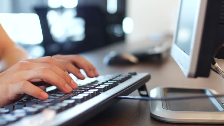 Working at a desk with a computer keyboard