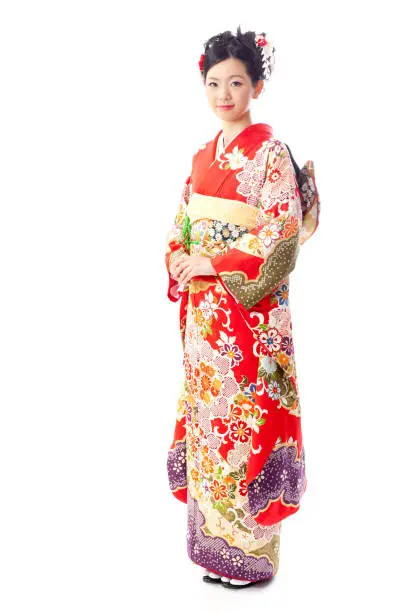 asian woman wearing traditional kimono named furisde isolated on white background