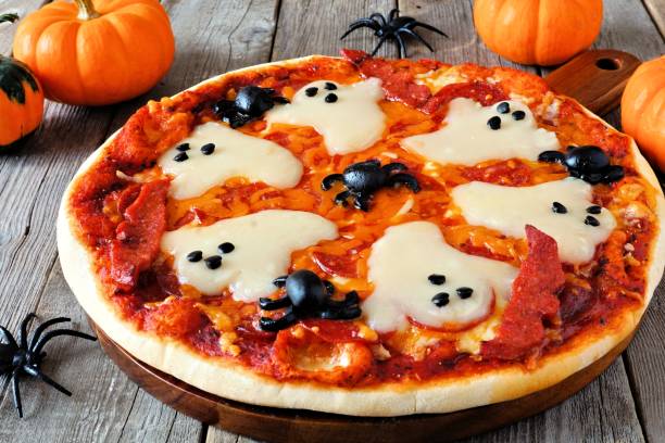 istock Halloween pizza close up on rustic wood 841372938