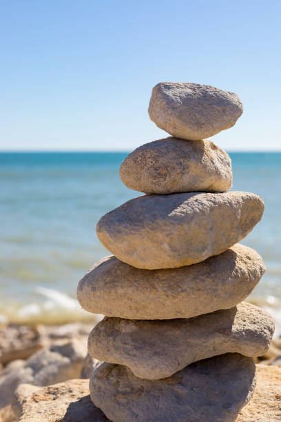 istock Piled up rocks by the ocean 841373212