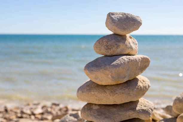 istock Piled up rocks by the ocean 841373234