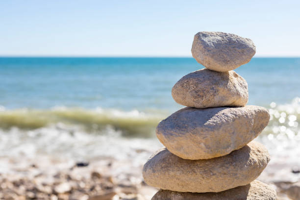 istock Piled up rocks by the ocean 841373258