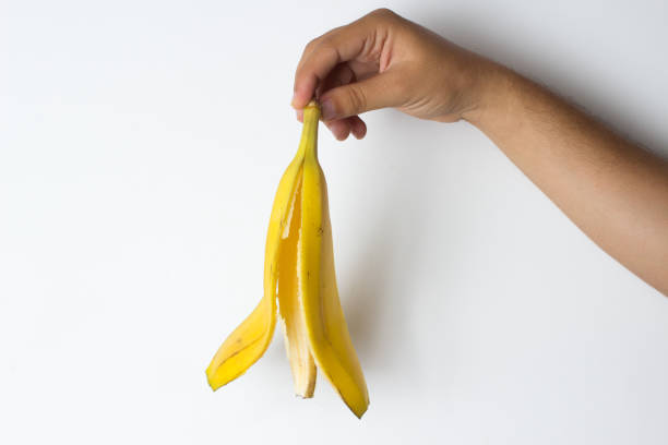 istock Hand holding a banana peel 841376098