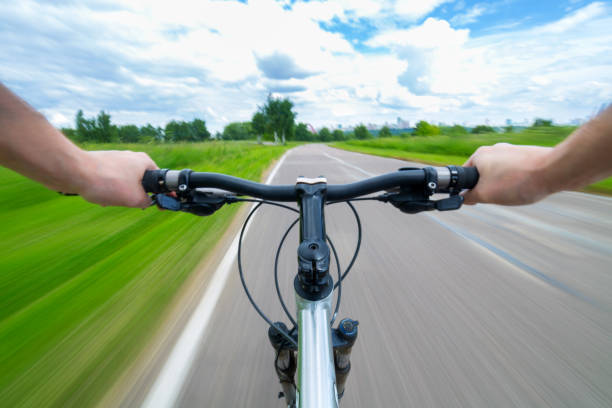 Cyclist passing fast on bicycle path with motion blur