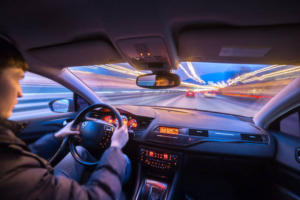 istock Night city road view from inside car 841379402