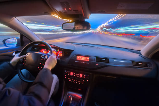 istock Night city road view from inside car 841379464