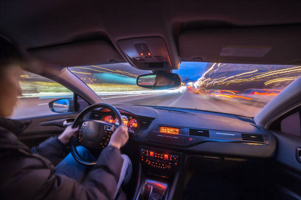 istock Night city road view from inside car 841379544