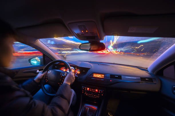 istock Night city road view from inside car 841379582