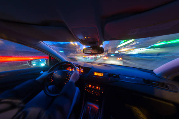 istock Night city road view from inside car 841379618