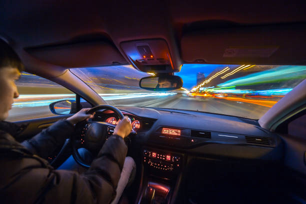 istock Night city road view from inside car 841379834