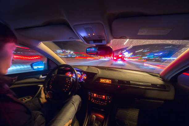 istock Night city road view from inside car 841380092