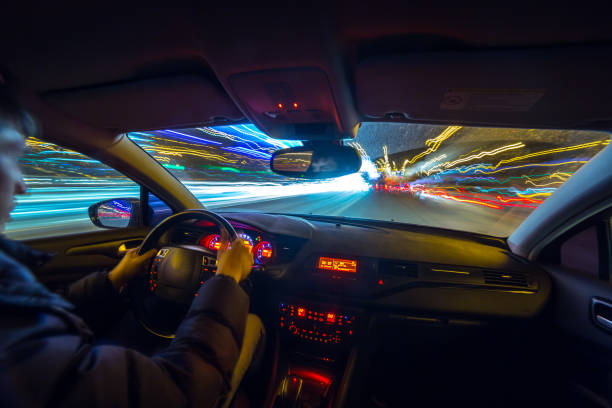istock Night city road view from inside car 841380390