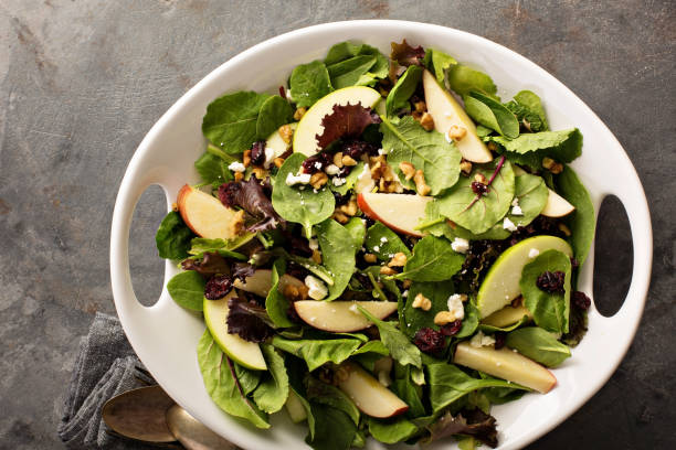 istock Fall salad with spring mix, apple and cranberry 841380640