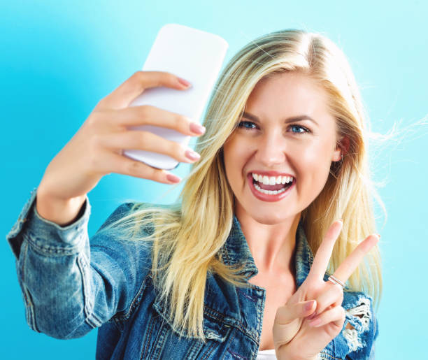 istock Young woman taking a selfie 841380864