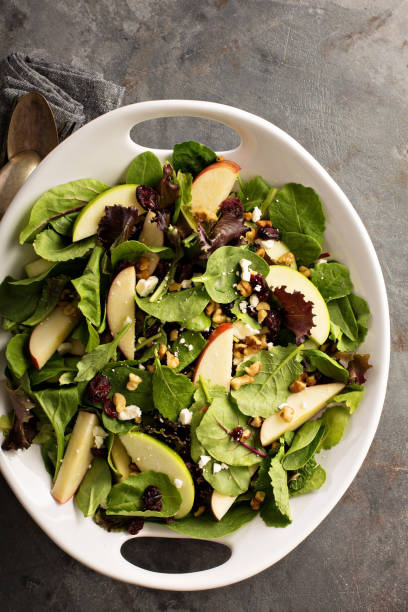 istock Fall salad with spring mix, apple and cranberry 841383260