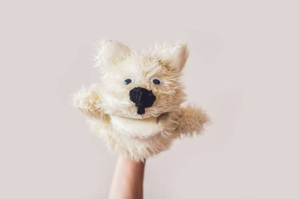 istock Puppet show dog on a gray background. Space for text or replicas 841386834