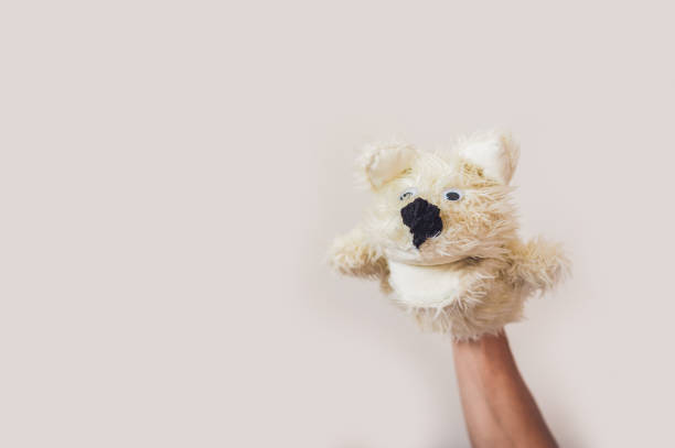 istock Puppet show dog on a gray background. Space for text or replicas 841386864