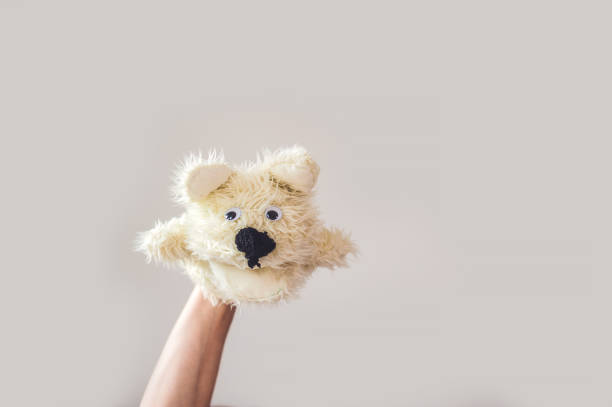 istock Puppet show dog on a gray background. Space for text or replicas 841386884