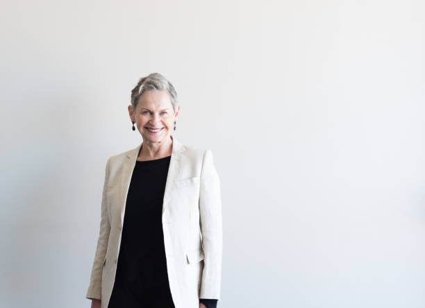 istock Older professional woman in beige jacket 841390602