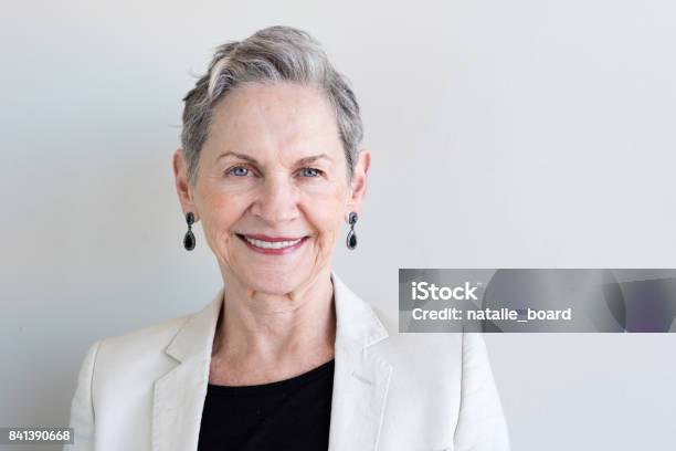 Older Woman In Beige Jacket Stock Photo - Download Image Now - Senior Women, Headshot, Portrait