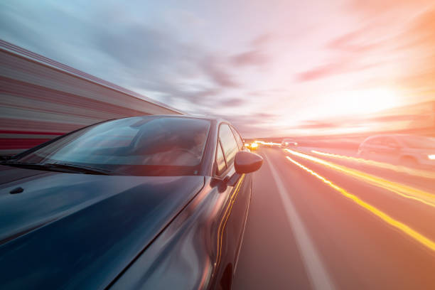 istock View from Side of Car moving on a sunset highway 841393490
