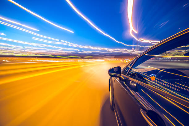 istock View from Side of Car moving in a night city 841396114
