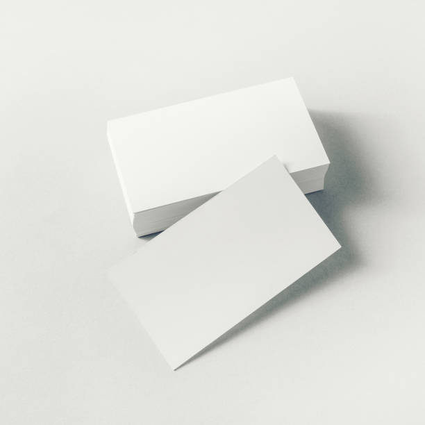 Blank business cards Photo of blank business cards on paper background. Mockup for ID. square business card mockup stock pictures, royalty-free photos & images