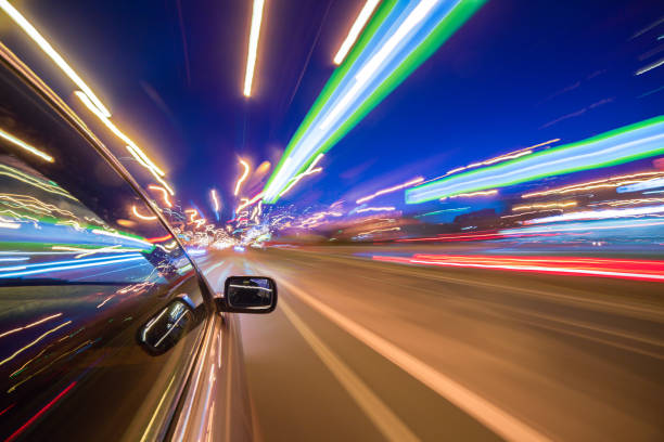 istock View from Side of Car moving in a night city 841404906