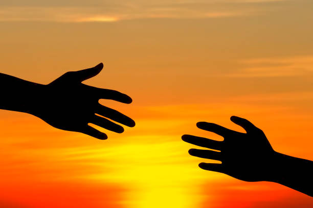 istock silhouette of helping hand concept. 841405780