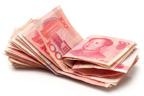 chinese currency on the white background - investment rmb savings china imagens e fotografias de stock