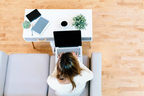 istock Happy young latina woman using her laptop at home 841408954